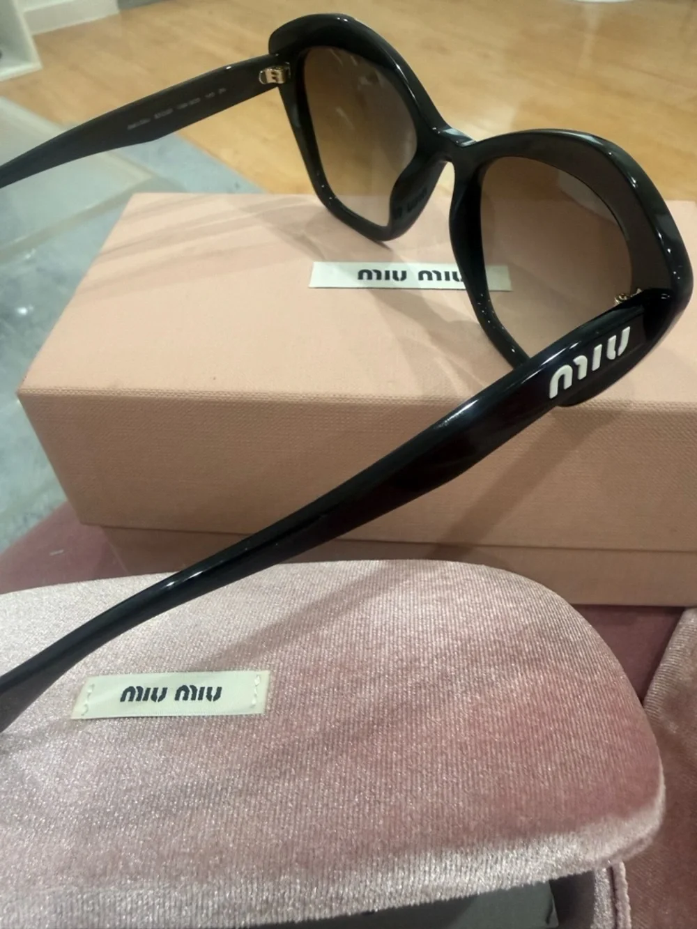 Miu Miu Black Cat-Eye Sunglasses with Dark Lenses
